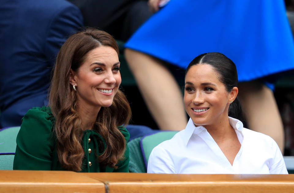 The Duchess of Cambridge and The Duchess of Sussex on day twelve of the Wimbledon Championships at the All England Lawn Tennis and Croquet Club, Wimbledon.