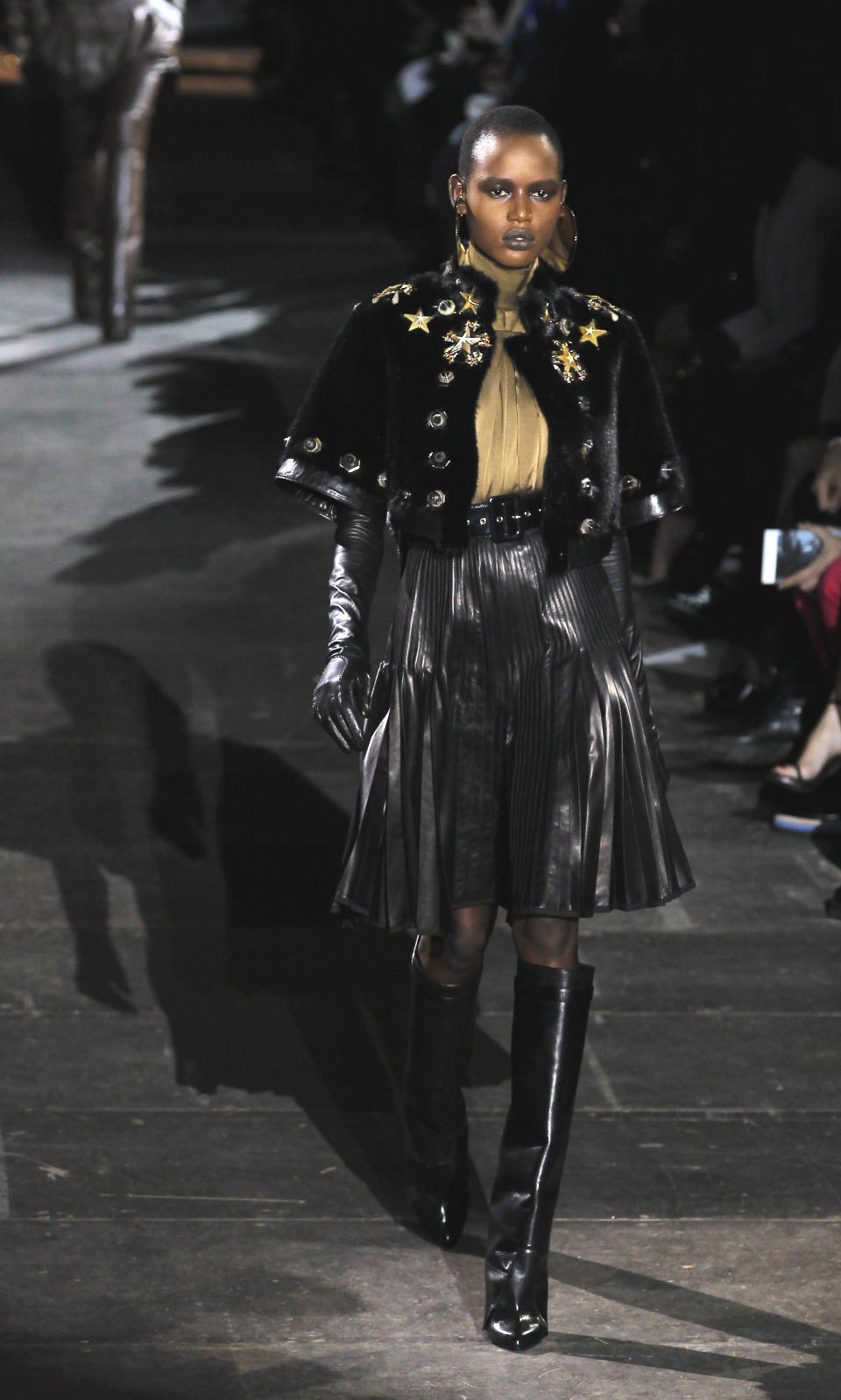 A model wears a creation by Italian fashion designer Riccardo Tisci for Givenchy's fashion house as part of the presentation for Women's Fall-Winter, ready-to-wear 2013 fashion collection, during Paris Fashion week, Sunday, March 4, 2012. (AP Photo/Jacques Brinon)