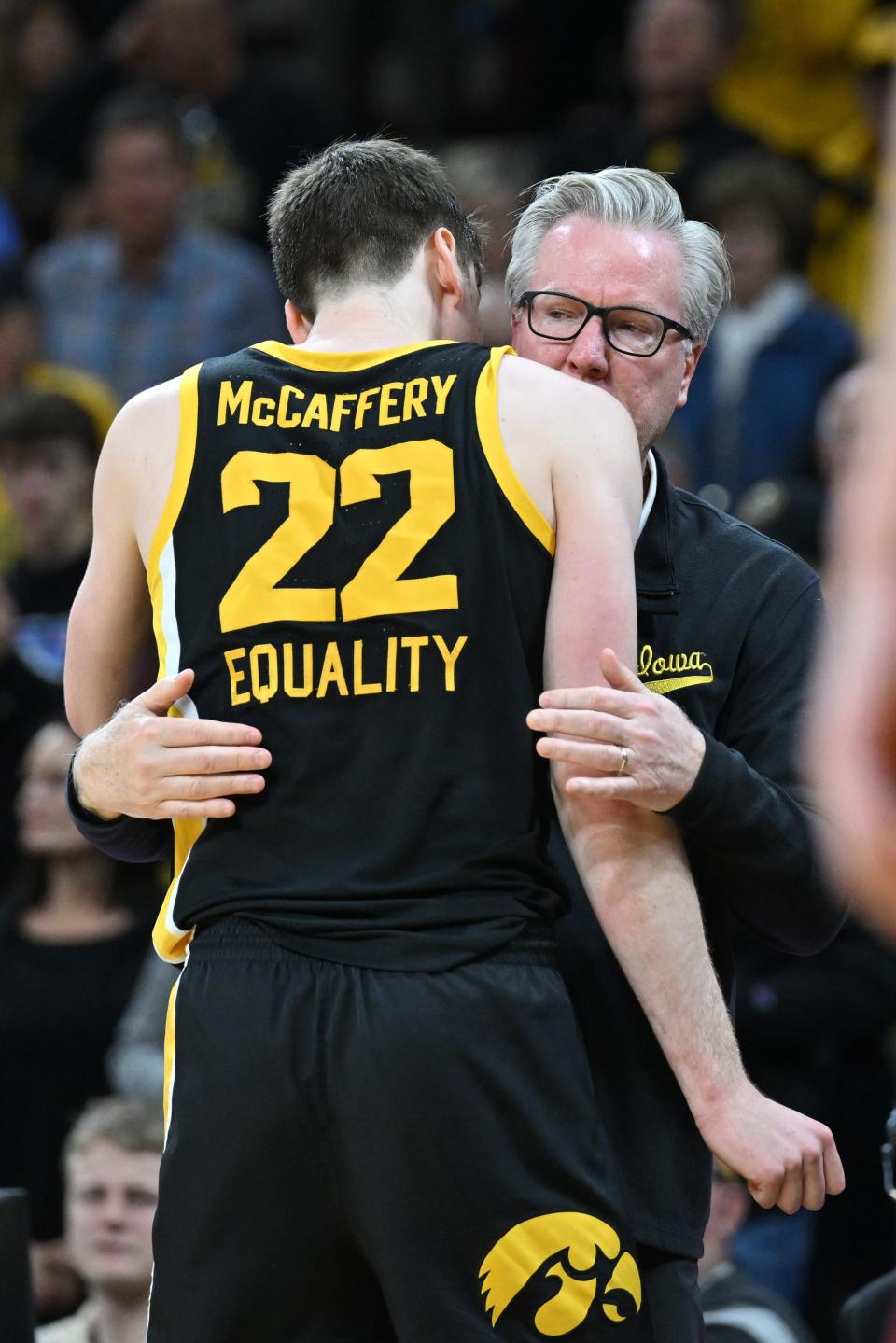 Iowa basketball coach Fran McCaffery reacts with son Patrick McCaffery (22) after recent game.