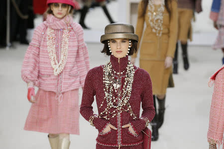 Models present creations by German designer Karl Lagerfeld as part of his Fall/Winter 2016/2017 women's ready-to-wear collection for fashion house Chanel at the Grand Palais in Paris, France, March 8, 2016. REUTERS/Gonzalo Fuentes