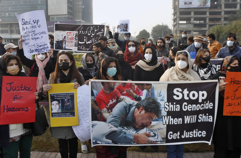 Members of a civil society organization hold a demonstration to protest the killing of coal mine workers by gunmen near the Machh coal field, in Lahore, Pakistan, Thursday, Jan. 7, 2021. Pakistan's minority Shiites continued their sit-in for a fifth straight day insisting they will bury their dead only when Prime Minister Imran Khan personally visits them to assure protection. (AP Photo/K.M. Chaudary)