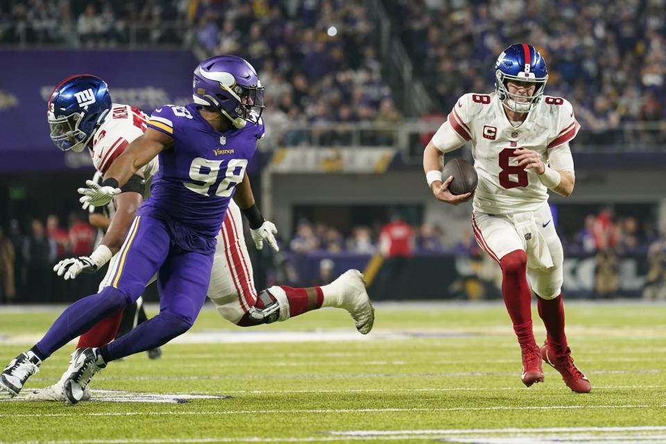 New York Giants' Daniel Jones runs during the second half of an NFL wild card football game against the Minnesota Vikings Sunday, Jan. 15, 2023, in Minneapolis. (AP Photo/Abbie Parr)