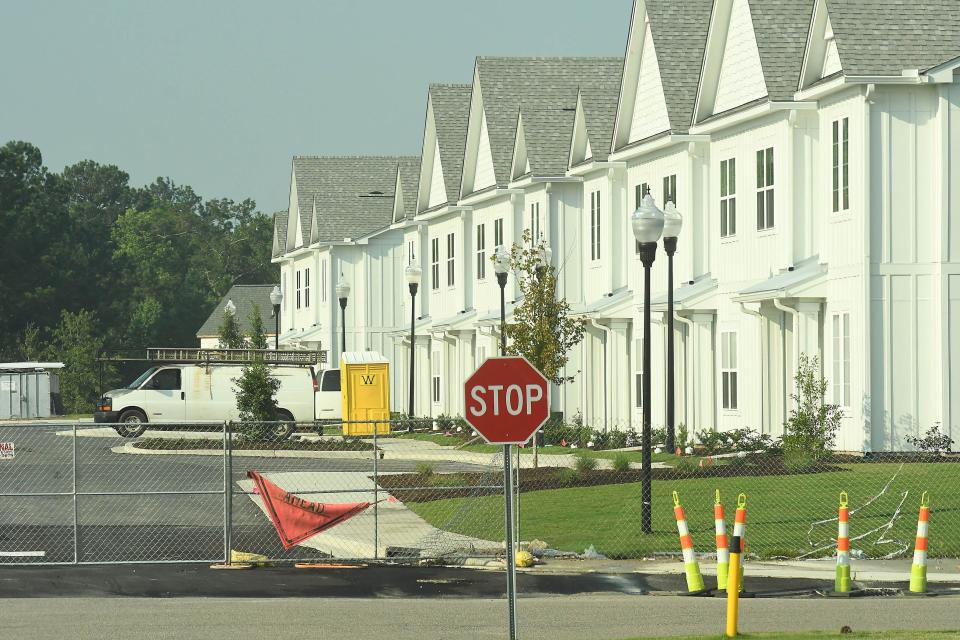 Construction continues on new homes and apartments along West Gate Drive in Leland. Summer Bay Villas, Westgate Apartment Homes and Cape Cottages are just some of the new areas being built behind the new Lowe's Home Improvement and Walmart.