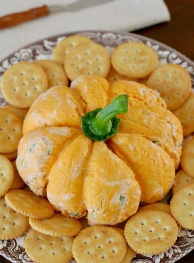 <p><a href="https://www.thecountrycook.net/pumpkin-shaped-cheese-ball/" rel="nofollow noopener" target="_blank" data-ylk="slk:The Country Cook;elm:context_link;itc:0;sec:content-canvas" class="link ">The Country Cook</a></p>