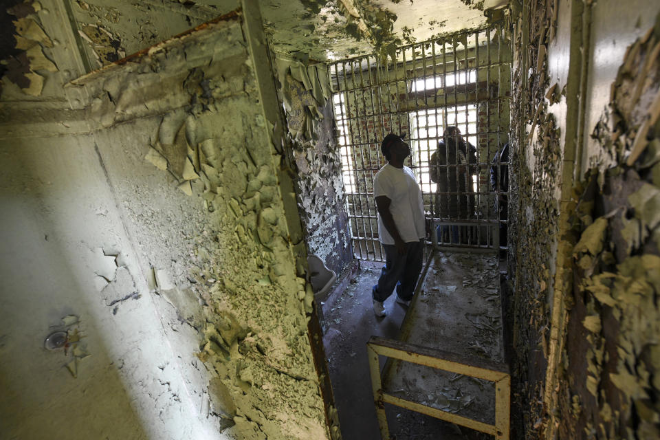 In this Feb. 29, 2020, photo, Cleon Orange looks around the Perry County Jail cell in Marion, Ala., where his father, the Rev. James Orange, a project coordinator for the Southern Christian Leadership Conference, was housed in 1965 after his arrest while organizing a voter registration drive. Orange was held on charges of disorderly conduct and contributing to the delinquency of minors. (AP Photo/Julie Bennett)