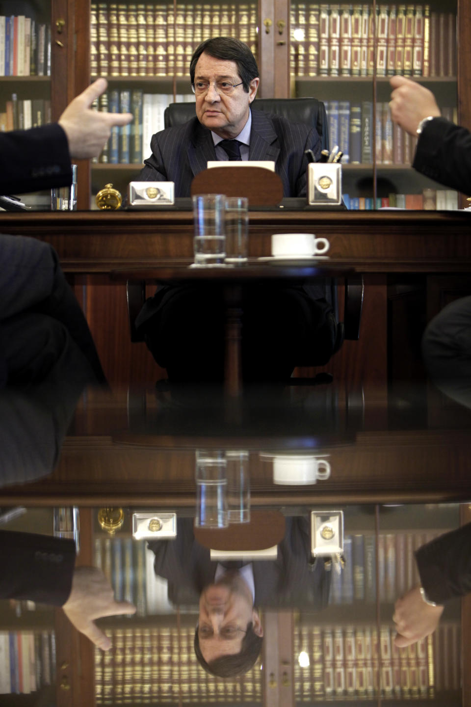 Cyprus' President Nicos Anastasiades listens during an interview with Associated Press at his office in the presidential palace in capital Nicosia, Cyprus, on Monday, Feb. 17, 2014. Cyprus’ president says an agreement reunifying the ethnically-divided island nation would allow energy hungry Turkey to be supplied with newly found Cypriot and Israeli natural gas and would contribute to mending broken-down relations between Ankara and Tel Aviv. (AP Photo/Petros Karadjias)