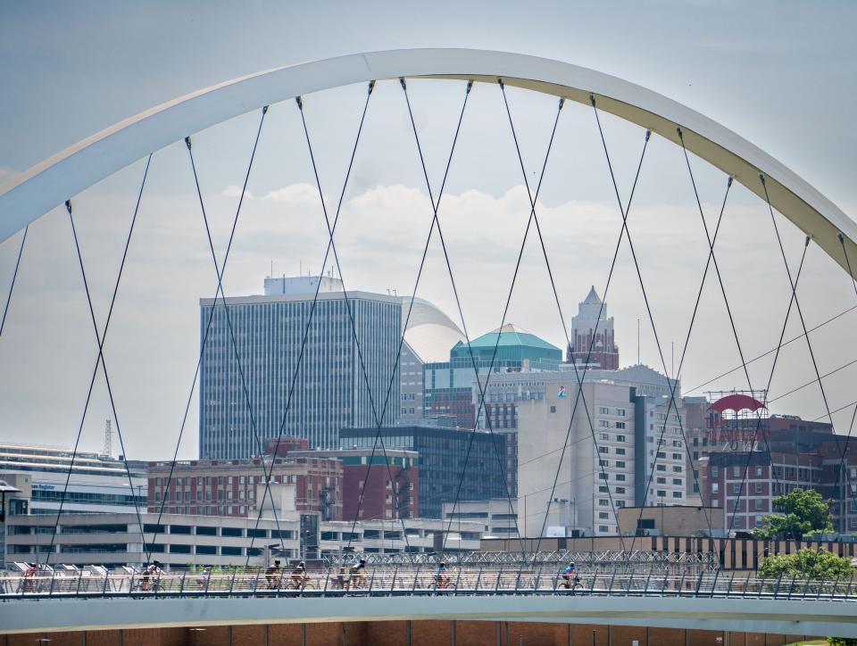 Riders roll into Des Moines during the RAGBRAI route inspection ride Wednesday.