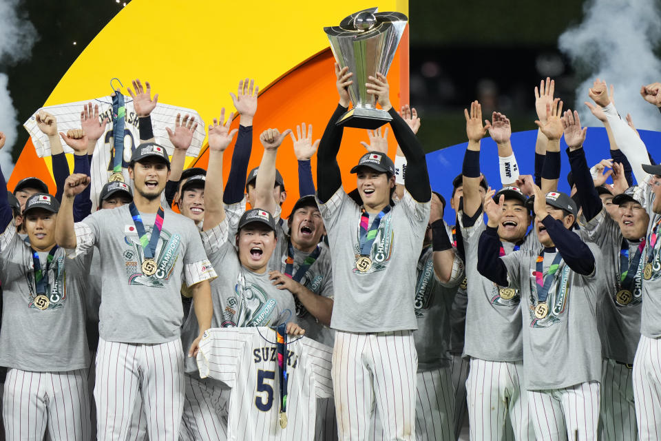 Japan players celebrate after defeating the United States in the World Baseball Classic championship game, Tuesday, March 21, 2023, in Miami. (AP Photo/Wilfredo Lee)