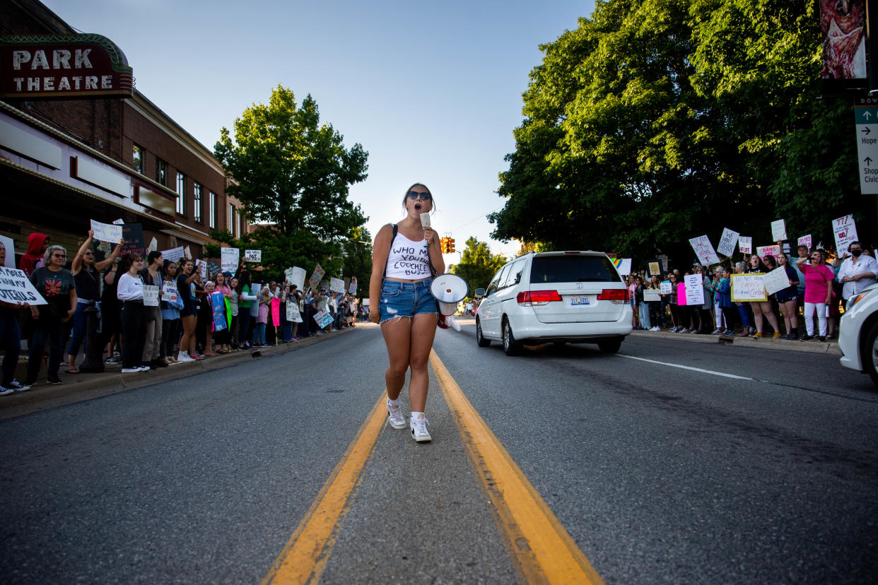 Mariah Stewart leads the crowd as they chant during a protest against the Supreme Court's recent decision to overturn Roe v. Wade Monday, June 27, 2022, in downtown Holland. 