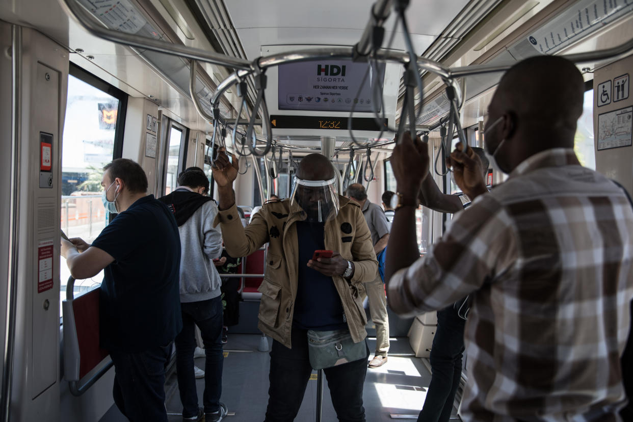 People seen in tram while people wear a mask in Istanbul, Turkey on June 05, 2020.  The Turkish government took a set of decisions to ease restrictions against the novel coronavirus (COVID-19) for the &quot;new normal&quot; process. (Photo by Cem Tekkeinolu/NurPhoto via Getty Images)