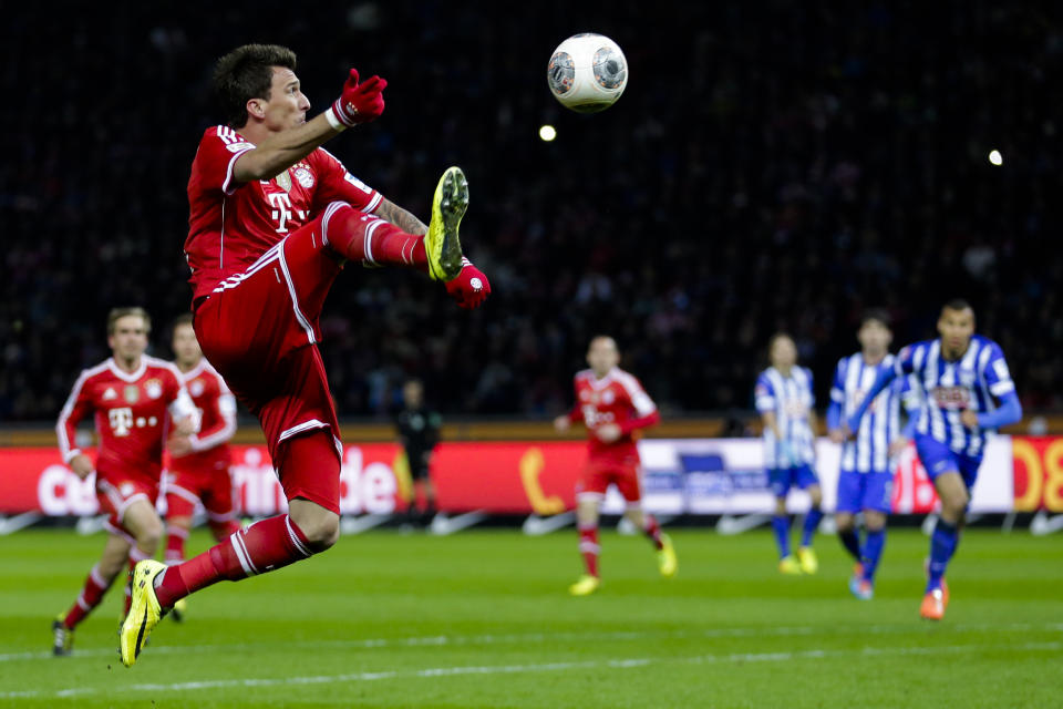 Bayern's Mario Mandzukic of Croatia plays the ball during the first division Bundesliga soccer match between Hertha BSC and FC Bayern Munich in Berlin, Tuesday, March 25, 2014. (AP Photo/Markus Schreiber)