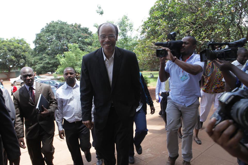 Former U S Congressman, Mel Reynolds, arrives to appear at the magistrates courts in Harare, Wednesday, Feb. 19, 2014. Reynolds was arrested in Zimbabwe for allegedly possessing pornographic material and violating immigration laws. (AP Photo/Tsvangirayi Mukwazhi)