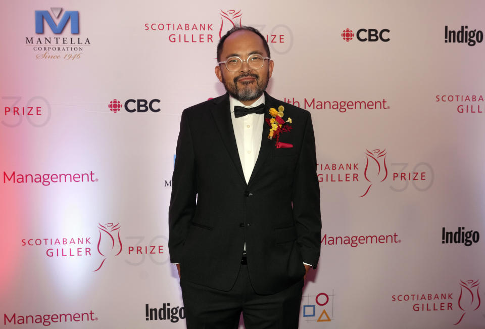 Kevin Chong, nominated for his novel "The Double Life of Benson Yu" arrives on the red carpet for the Scotiabank Giller Prize in Toronto, Monday, Nov. 13, 2023. (Chris Young/The Canadian Press via AP)