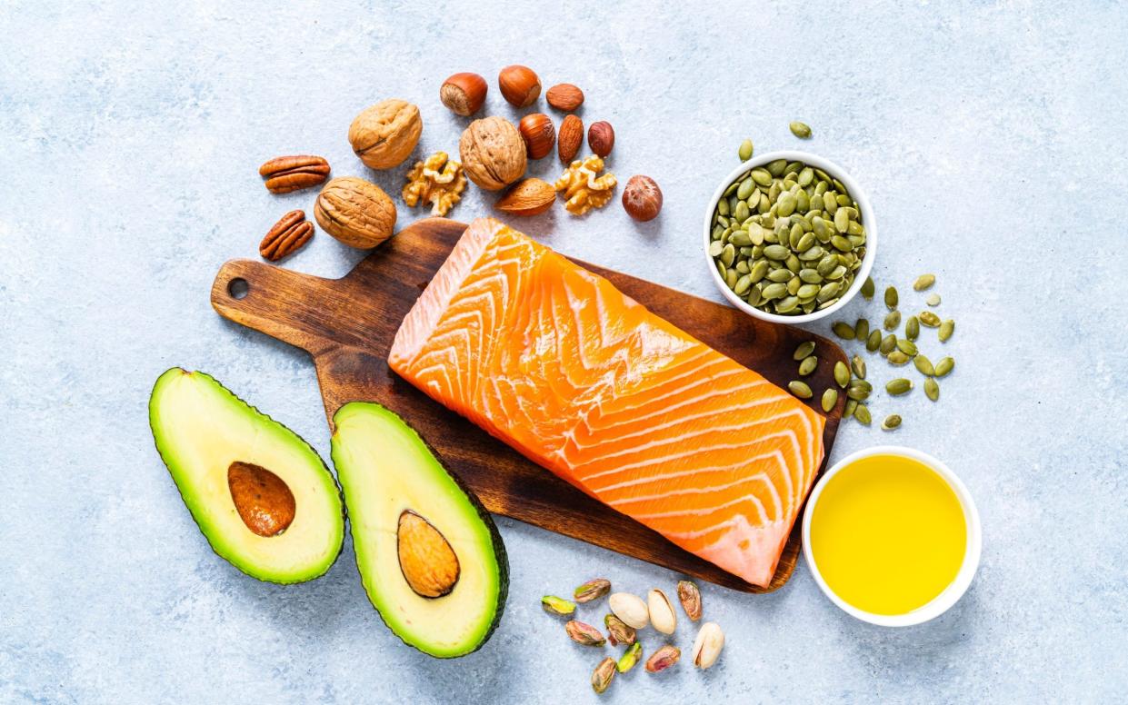 The composition includes salmon, avocado, extra virgin olive oil, nuts and seeds like walnut, almonds, pecan, hazelnuts, pistachio and pumpkin seeds - Getty