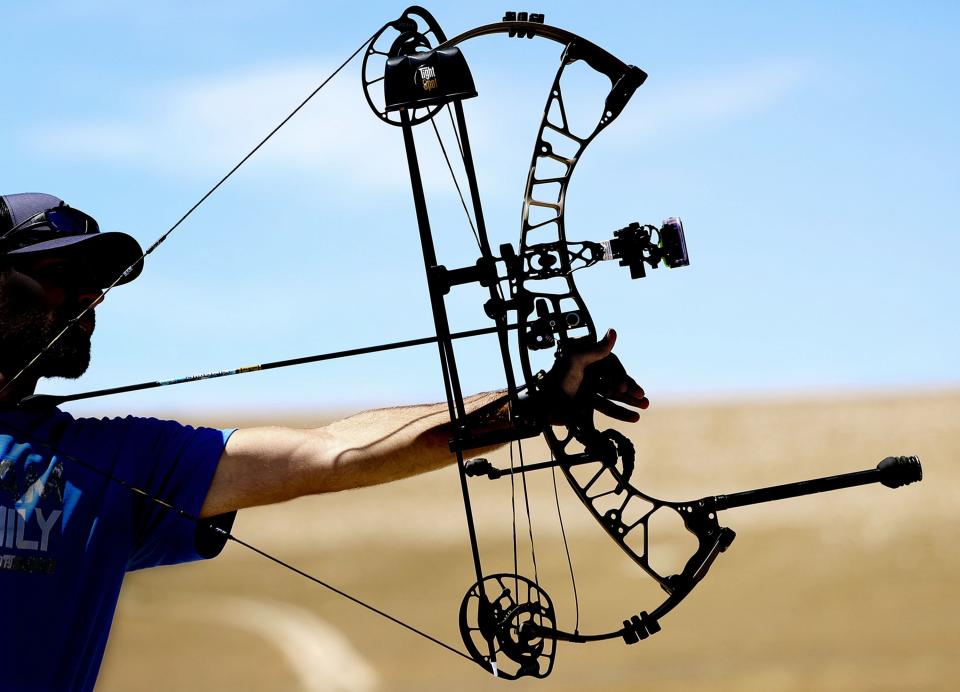 Tanner Smedley aims a hunting bow during a “fun shoot” at Antelope Island State Park on Wednesday, July 19, 2023. | Laura Seitz, Deseret News