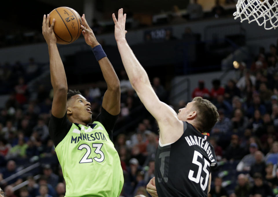 Minnesota Timberwolves guard Jarrett Culver (23) shoots on Houston Rockets center Isaiah Hartenstein (55) in the first quarter during an NBA basketball game Saturday, Nov. 16, 2019 in Minneapolis. (AP Photo/Andy Clayton- King)