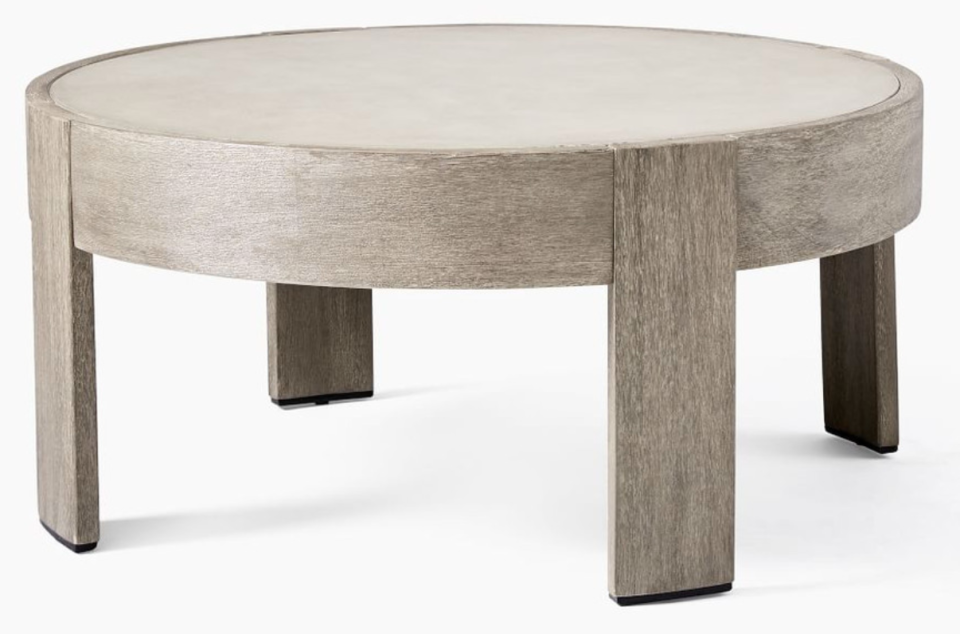 grey outdoor coffee table with concrete top and wooden legs from West Elm 