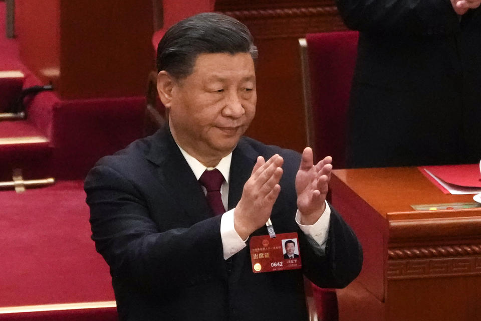 FILE - Chinese President Xi Jinping applauds at the closing ceremony for China's National People's Congress (NPC) at the Great Hall of the People in Beijing, Monday, March 13, 2023. Brazil's President Luiz Inácio Lula da Silva flew off to China on Tuesday to strengthen ties with his nation's biggest trade partner and win support for his long-shot push for peace in Ukraine. China and Brazil are expected to sign at least 20 bilateral agreements during Lula's two-day stay, according to the presidential palace. He will visit Shanghai and Beijing, and meet his counterpart Xi Jinping on Apr. 14. (AP Photo/Andy Wong, File)