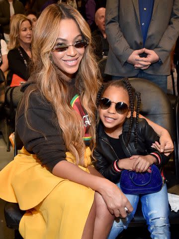 <p>Kevin Mazur/WireImage</p> Beyonce (L) and Blue Ivy Carter attend the 67th NBA All-Star Game