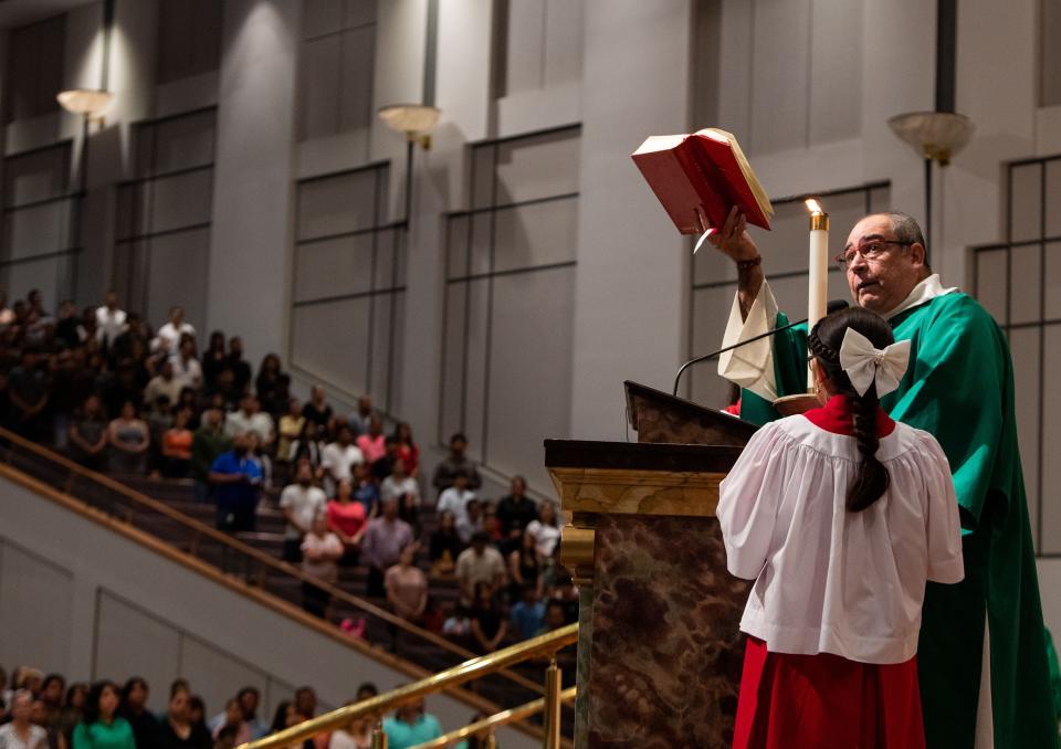 Deacon Anselmo Ambriz prays with the congregation at the Iglesia Sagrado Corazon de Jesus in Nashville, Tenn., Sunday, July 14, 2024.