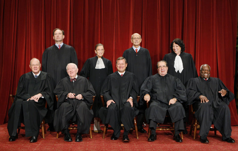 FILE - With the addition of the Supreme Court's newest member, Associate Justice Sonia Sotomayor, top row, right, the high court sits for a new group photograph, Sept. 29, 2009, at the Supreme Court in Washington. Front row from left are: Associate Justice Anthony M. Kennedy, Associate Justice John Paul Stevens, Chief Justice John G. Roberts, Associate Justice Antonin Scalia, and Associate Justice Clarence Thomas. Back row, from left are: Associate Justice Samuel Alito Jr., Associate Justice Ruth Bader Ginsburg, Associate Justice Stephen Breyer, and Associate Justice Sonia Sotomayor. (AP Photo/Charles Dharapak, File)