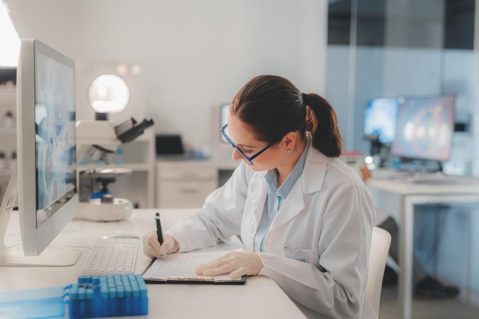 A scientist reviewing data in a lab.