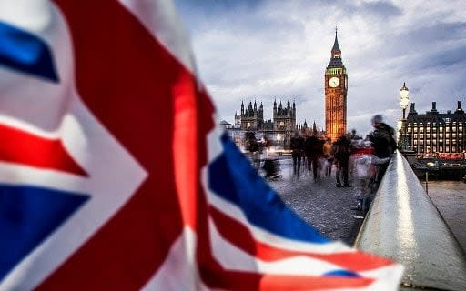Double exposure of flag and Westminster Palace with Big Ben