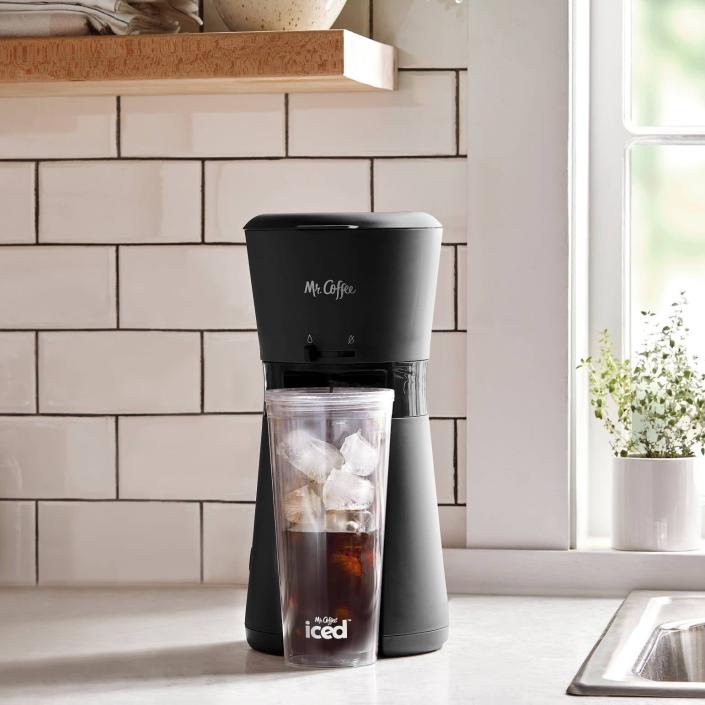 <p>If they can't go without their iced coffee, rain or shine, they need the <span>Mr. Coffee Iced Coffee Maker With Reusable Tumbler and Coffee Filter</span> ($25, originally $35). It brews a perfectly chilled cup in less than four minutes. They just need to add water and their favorite coffee grounds to the machine, fill the tumbler with ice, and brew. Finish off with milks, sweeteners, and syrups.</p>
