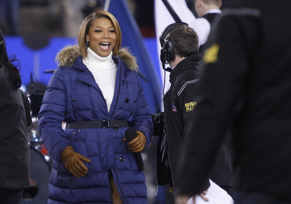 Singer Queen Latifah reacts after performing "America the Beautiful" prior to the start of the NFL Super Bowl XLVIII football game in East Rutherford