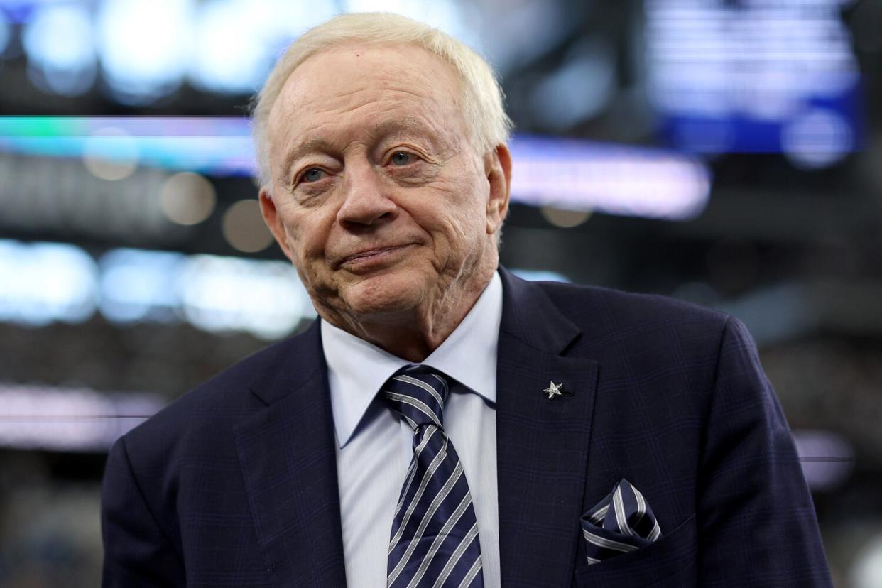 Dallas Cowboys owner Jerry Jones interacts with fans during warmups
