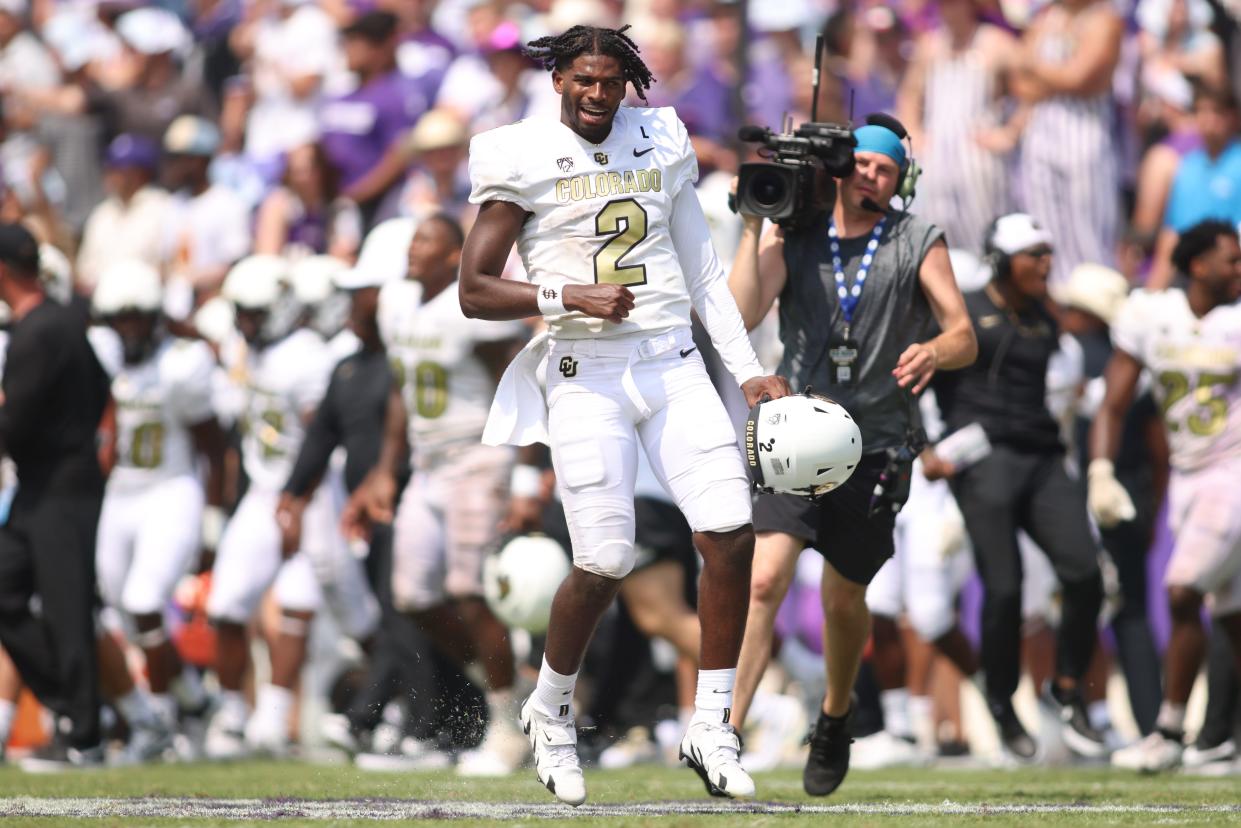 Colorado quarterback Shedeur Sanders (2) celebrates after his team's defeat of TCU at Amon G. Carter Stadium.