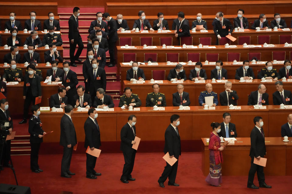 Delegates line up to cast their votes during a session of China's National People's Congress (NPC) to select state leaders at the Great Hall of the People in Beijing, Friday, March 10, 2023. (AP Photo/Mark Schiefelbein)