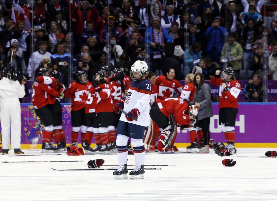 Michelle Picard of the United States (23) skates back to the bench after Canada scored in overtime to win the women's gold medal ice hockey game 3-2 at the 2014 Winter Olympics, Thursday, Feb. 20, 2014, in Sochi, Russia. (AP Photo/Matt Slocum)