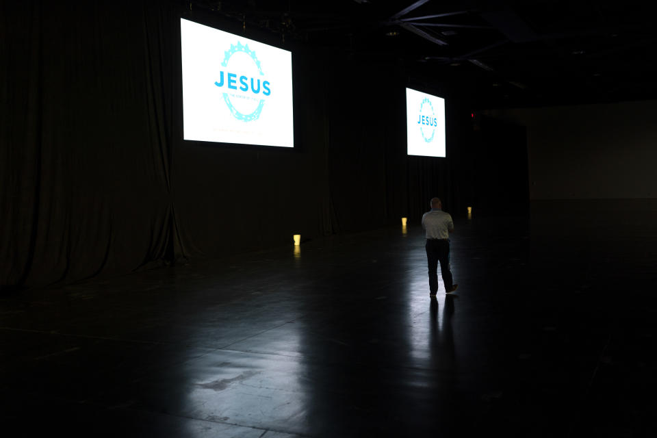 An attendee talks on the phone before the start of a session at the Southern Baptist Convention’s annual meeting in Anaheim, Calif., Tuesday, June 14, 2022. (AP Photo/Jae C. Hong)