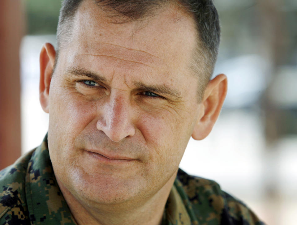 FILE - In this Oct. 6, 2006, file photo, Marine Corps Lt. Col. Colby Vokey listens to a question about the allegations of abuse at Guantanamo Bay during an interview with the Associated Press at Camp Pendleton Marine Corps Base, Calif. Vokey, who is the Marine Corps' defense coordinator for the western United States, has called for an investigation, saying the abuse alleged in the affidavit "is offensive and violates United States and international law." The San Diego Union-Tribune says the lawsuit filed Friday, Sept. 13, 2019, in Texas by Petty Officer 1st Class Edward Gallagher claims his case was not defended properly. The filing says attorneys Colby Vokey and Phillip Stackhouse, along with United American Patriots, attempted to delay the case in an effort to maximize fundraising for the nonprofit. (AP Photo/Denis Poroy, File)