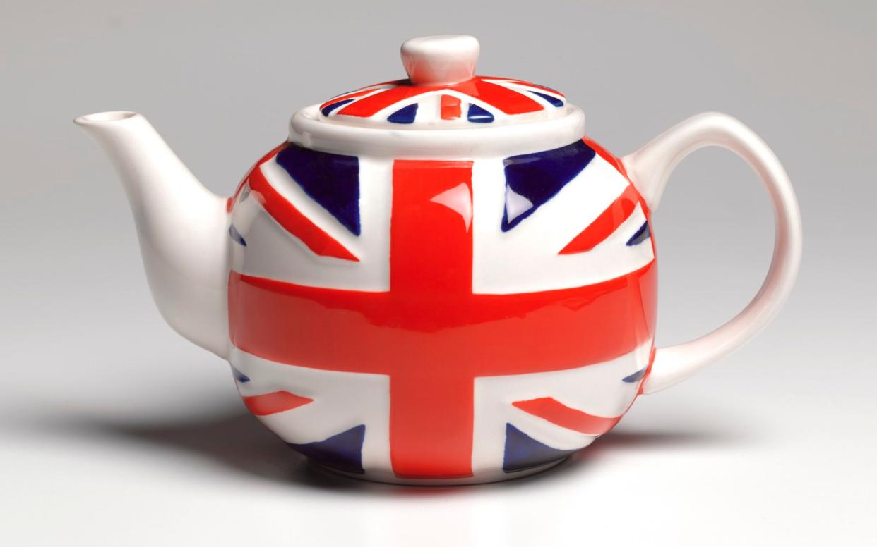 Close up of a union jack patterned teapot on white background