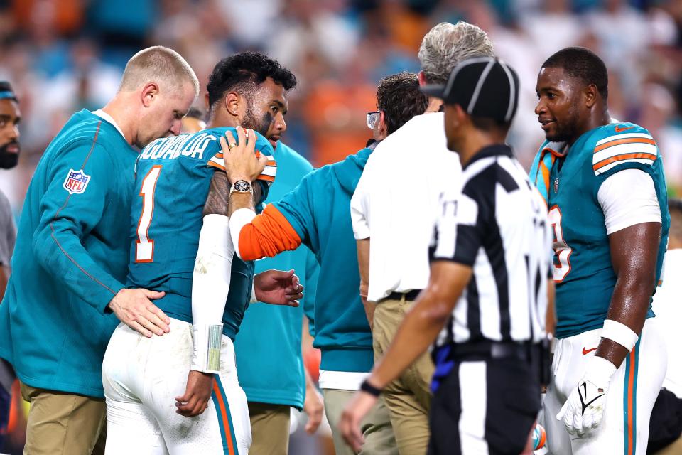 MIAMI GARDENS, FLORIDA - SEPTEMBER 12: Tua Tagovailoa #1 of the Miami Dolphins walks off the field after play on the field against the Buffalo Bills during the third quarter in the game at Hard Rock Stadium on September 12, 2024 in Miami Gardens, Florida. (Photo by Megan Briggs/Getty Images)