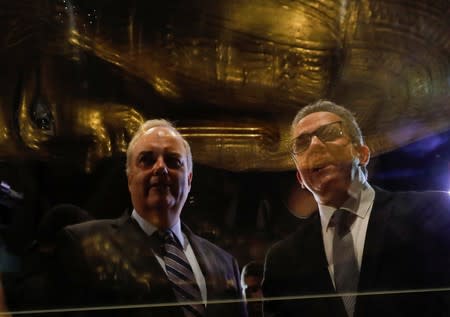 Egypt's Antiquities Minister Khaled El-Enany and US Charge d'Affaires in Cairo Thomas Goldberger talk to media near the Gold Coffin of Nedjemankh at the National Museum of Egyptian Civilization in Cairo