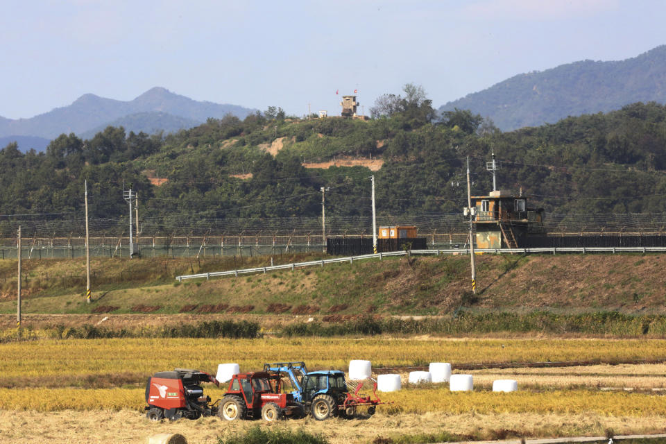 Military guard posts of North Korea, top, and South Korea, center, are seen in Paju, South Korea, near the border with North Korea, Tuesday, Oct. 15, 2019. Amid swine fever scare that grips both Koreas, South Korea is deploying snipers, installing traps and flying drones along the rivals' tense border to kill wild boars that some experts say may have spread the animal disease from north to south. (AP Photo/Ahn Young-joon)WLD