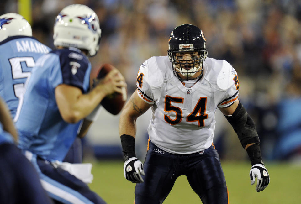 Former Chicago Bears linebacker Brian Urlacher battled tears and called the Chicago Bears “the best fans in the world” in his Hall of Fame induction speech. (AP Photo)