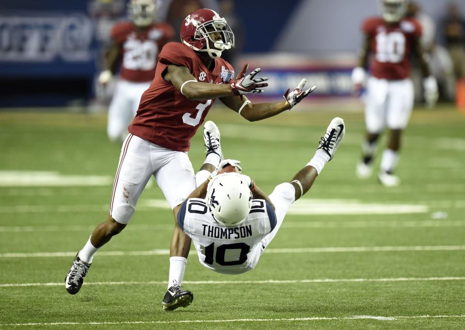 Aug 30, 2014; Atlanta, GA, USA; West Virginia Mountaineers wide receiver Jordan Thompson (10) makes a catch against Alabama Crimson Tide defensive back Bradley Sylve (3) during the third quarter of the 2014 Chick-fil-a kickoff game at Georgia Dome. Mandatory Credit: John David Mercer-USA TODAY Sports