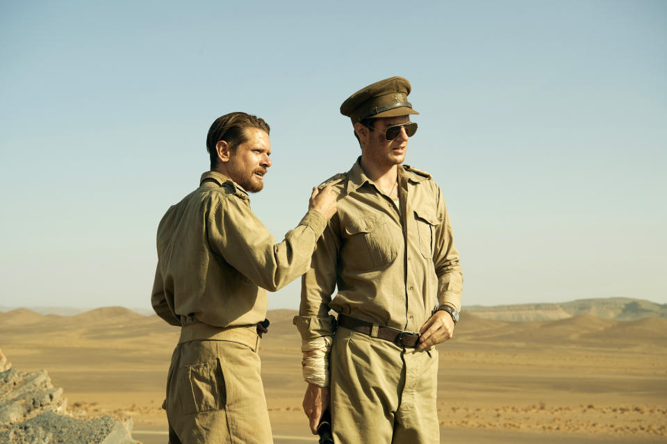This image released by Epix shows Jack O'Connell, left, and Connor Swindells in a scene from "Rogue Heroes." The series, about the origin of Britain’s elite Special Air Service, premieres Nov. 13 on Epix. (Epix via AP)