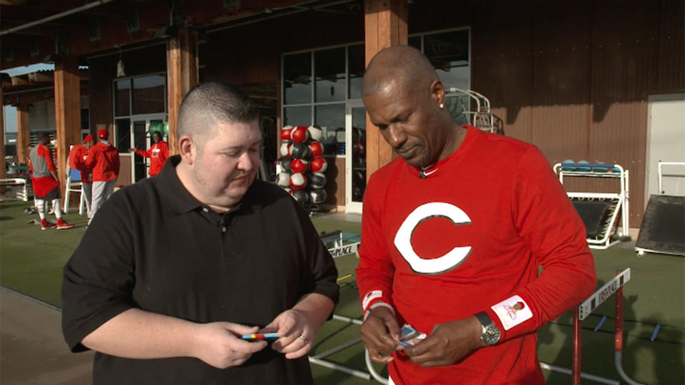 Eric Davis opening 25-year-old baseball cards with Yahoo Sports. (AP)