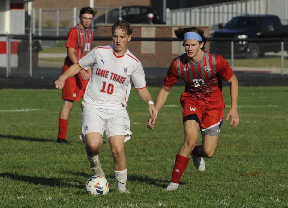 Zane Trace senior Jordan Harrington (#10) fights for control of the ball with Westfall's Dawson Spaniol (#20) during the Pioneers' 8-2 win over the Mustangs in boys soccer at Westfall High School on Sept. 18, 2023, in Williamsport, Ohio.