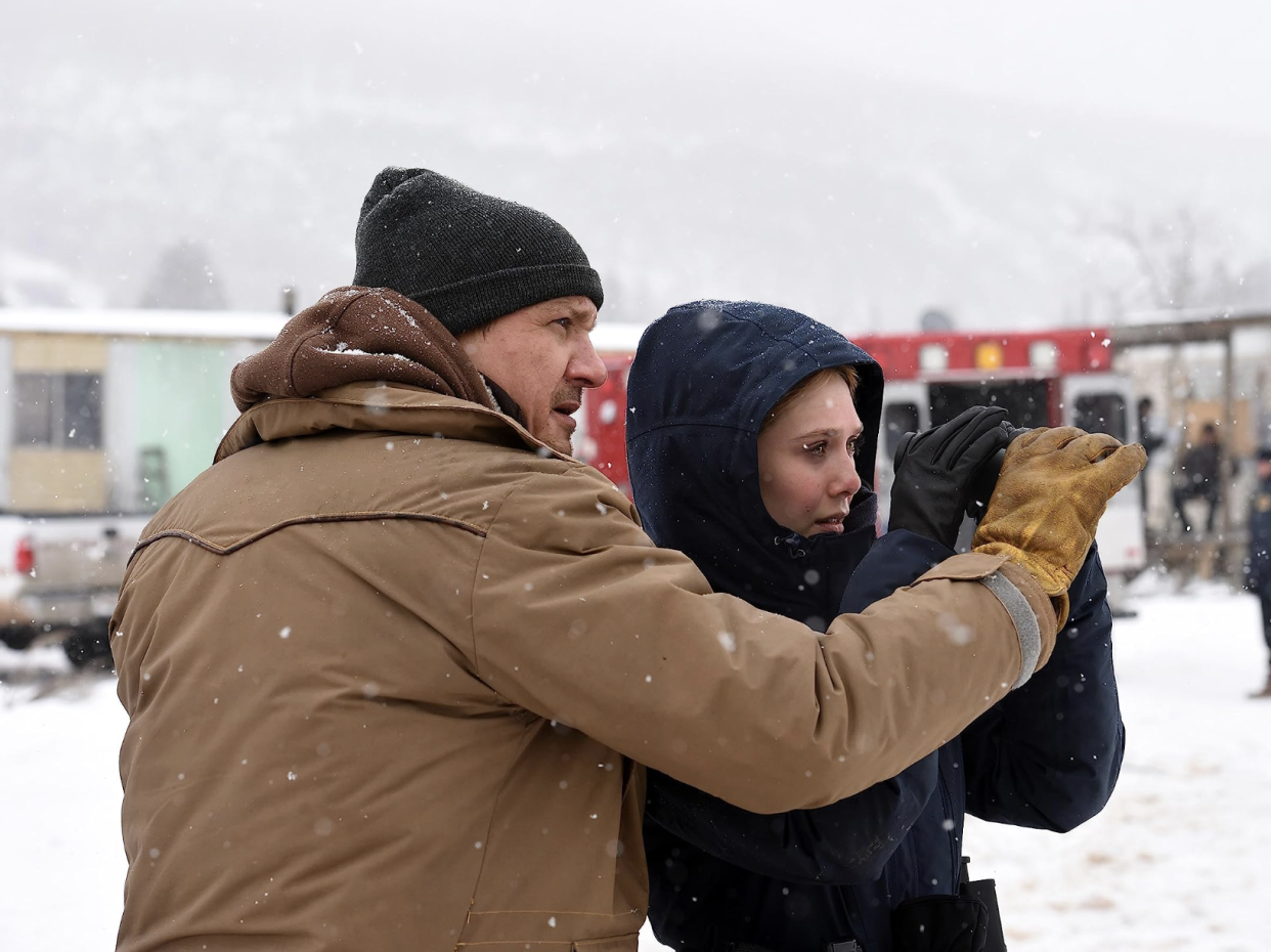 a scene from wind river with jeremy renner and elizabeth olsen