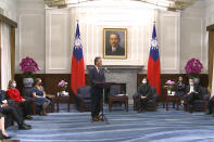 In this image made from video released by the Taiwan Presidential Office, U.S. Representative Mark Takano, D-Calif. speaks during a meeting with Taiwanese President Tsai Ing-wen, sitting center right, at the Presidential Office in Taipei, Taiwan on Friday, Nov. 26, 2021. Five U.S. lawmakers met with Taiwan President Tsai Friday morning in a surprise one-day visit intended to reaffirm the United States' "rock solid" support for the self-governing island. (Taiwan Presidential Office via AP)