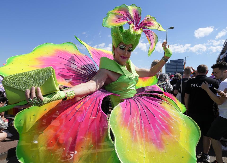 Participants of the Cologne Pride rally march through the city center in Cologne, Germany, Sunday, July 3, 2022. This year's Christopher Street Day (CSD) Gay Parade with thousands of demonstrators for LGBTQ rights is the first after the coronavirus pandemic to be followed by hundreds of thousands of spectators in the streets of Cologne. (AP Photo/Martin Meissner)