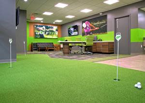 Lobby featuring Putting Green and Training Bays