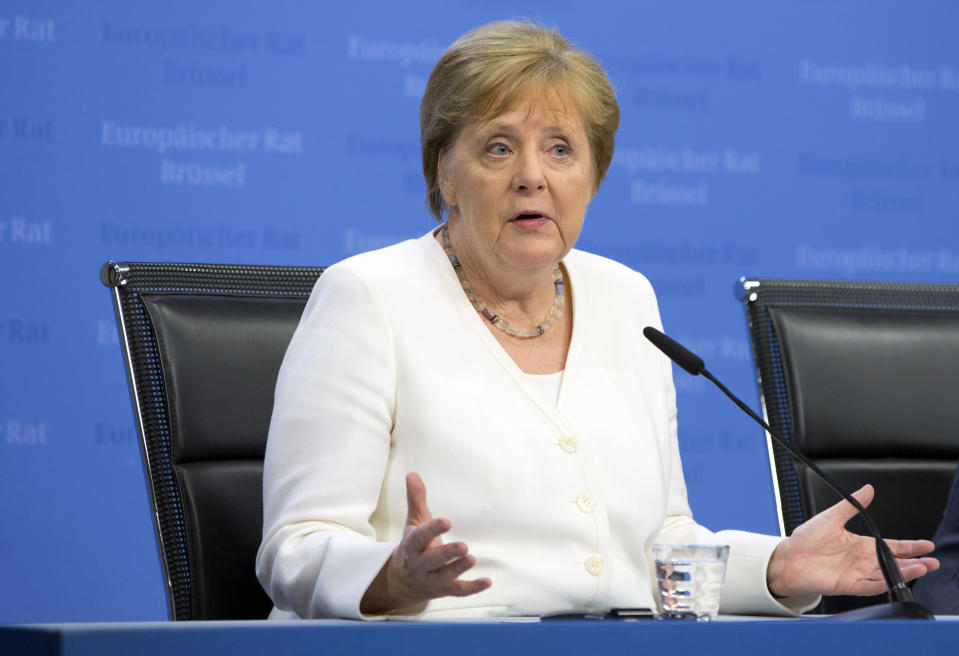 German Chancellor Angela Merkel speaks during a media conference at an EU summit in Brussels, Monday, July 1, 2019. European Union leaders continued a marathon session of talks on Monday desperately seeking a breakthrough in a diplomatic fight over who should be picked for a half dozen of jobs at the top of EU institutions. (AP Photo/Virginia Mayo)