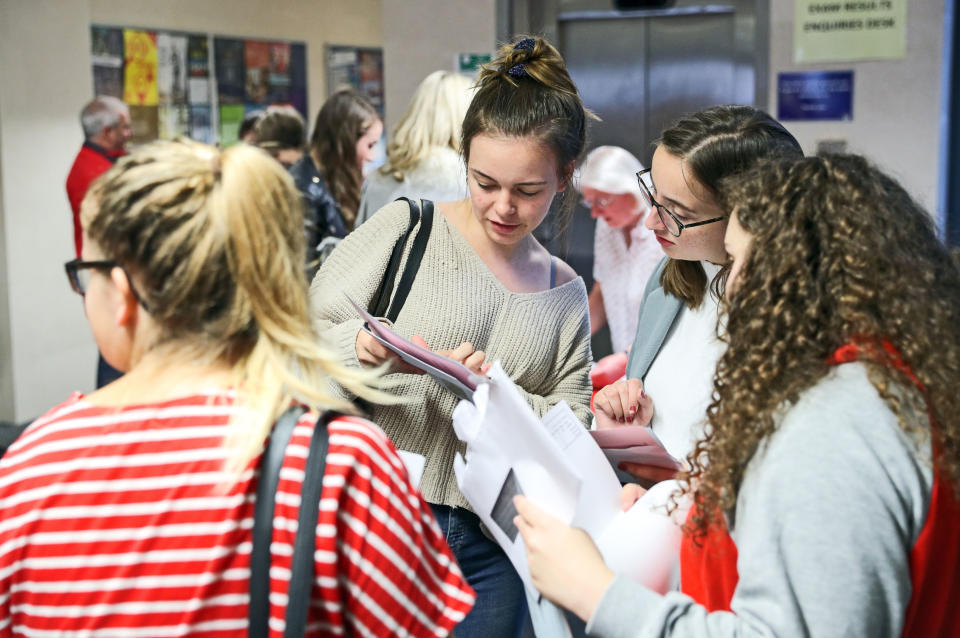 Pupils check their A Level results. Photo: Andrew Matthews/PA Wire